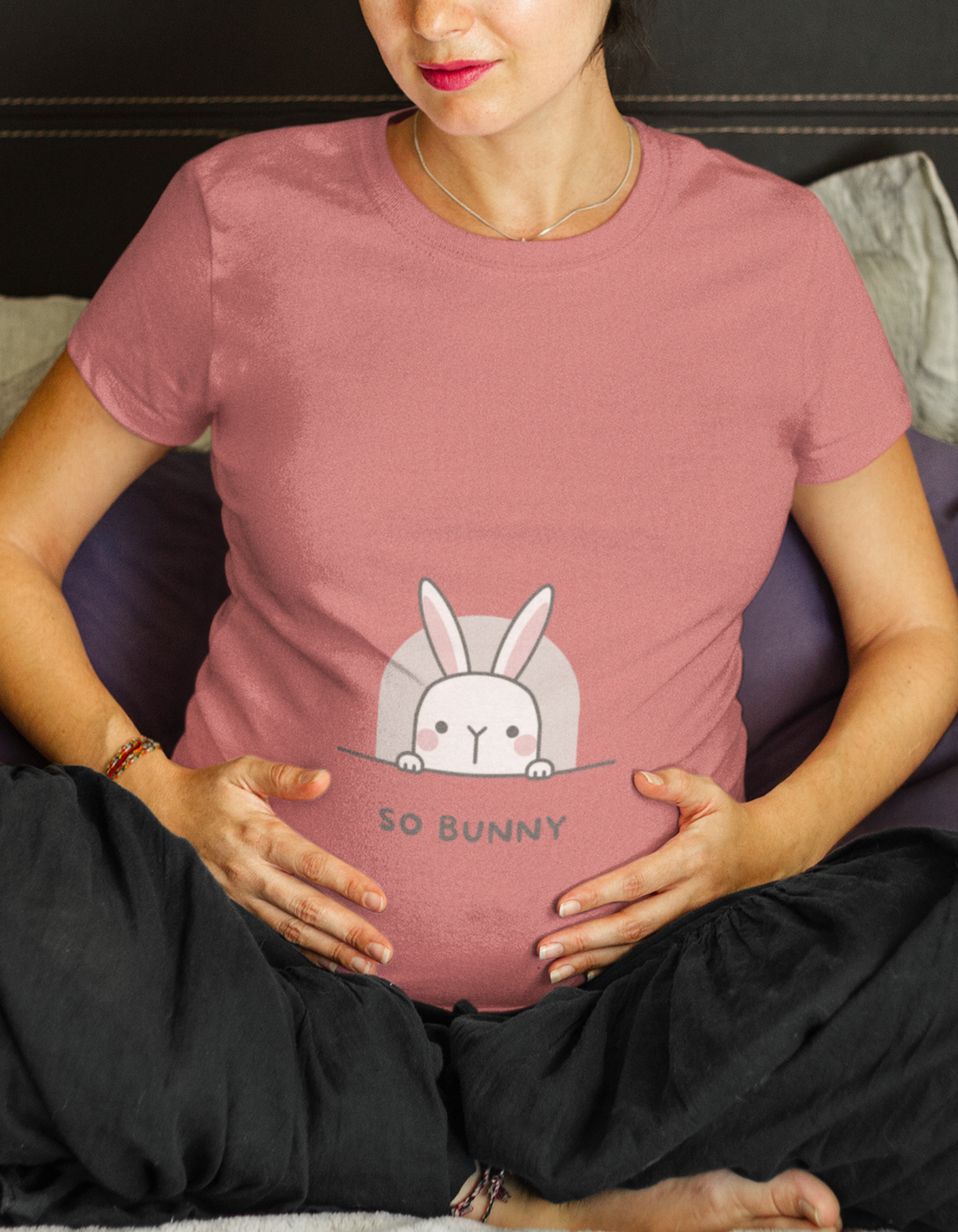 Express your playful side with our So Bunny pregnancy t-shirt. Designed with a cute bunny peaking out, it's the perfect blend of comfort and style. Discover the latest collection of women's t-shirts online at Womanitee and embrace maternity fashion with a touch of charm.