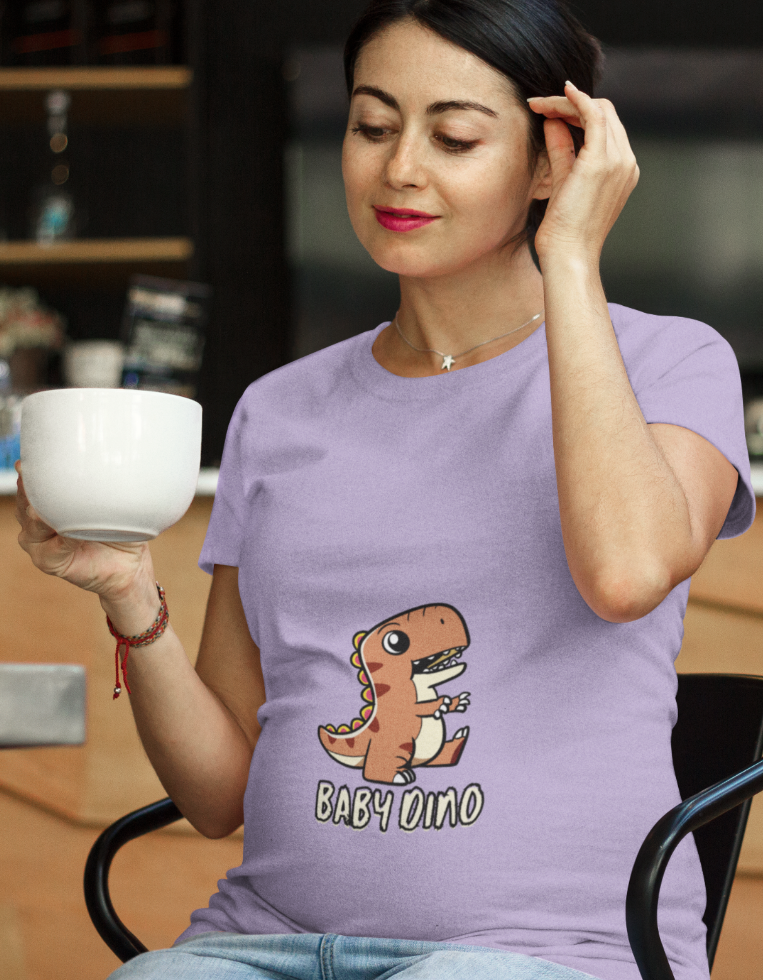 Unleash your inner mama-saurus with our trendy Baby Dino Pregnancy T-Shirt from Womanitee. Wrap your bump in softness and make a style statement during your pregnancy journey. Shop online now!