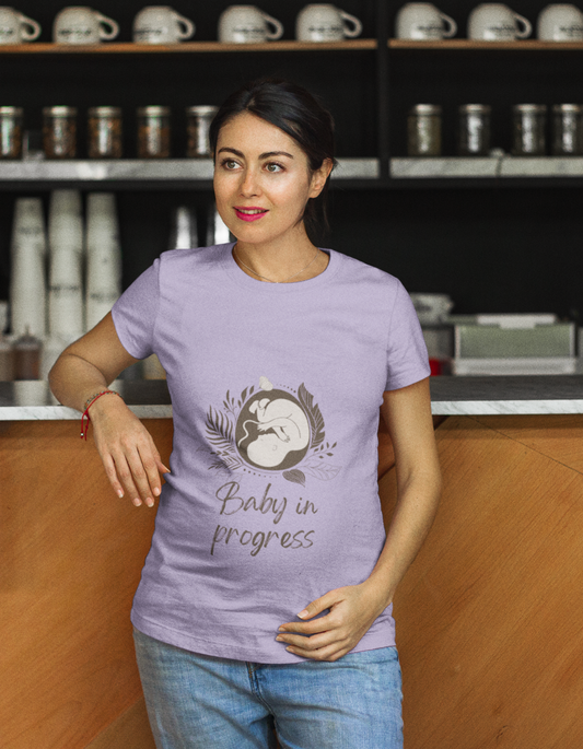 Let your pregnancy style shine with Womanitee's trendy Baby in Progress Pregnancy T-Shirt. Embrace comfort and celebrate the miracle of life. Shop now for women's graphic t-shirts online!