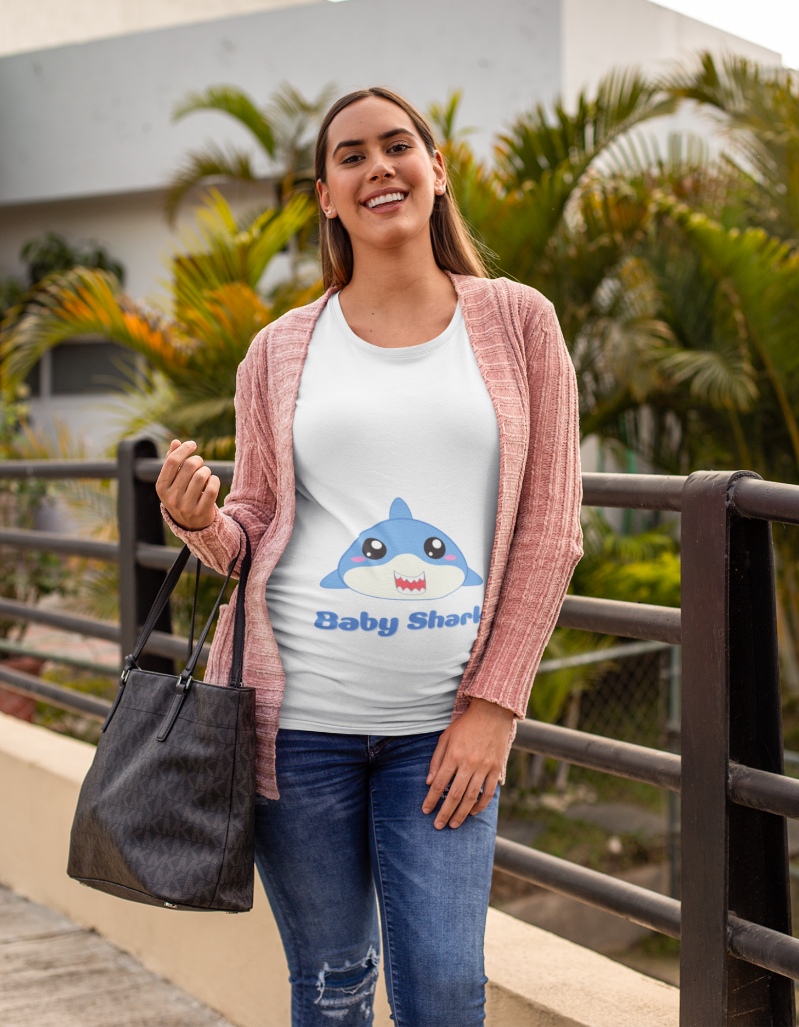 "Experience waves of joy and laughter with Womanitee's Baby Shark Pregnancy T-Shirt. Celebrate the miracle of motherhood with a touch of humor and style. Shop online for women's graphic t-shirts now!"