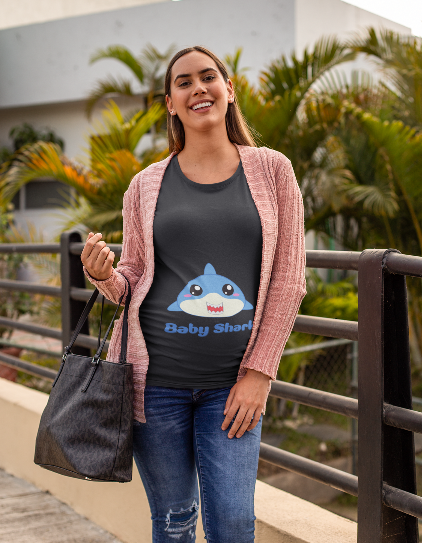 Unleash your inner mama shark with Womanitee's Baby Shark Pregnancy T-Shirt. Dive into comfort and cuteness while embracing the joys of pregnancy. Shop now for women's t-shirts online!