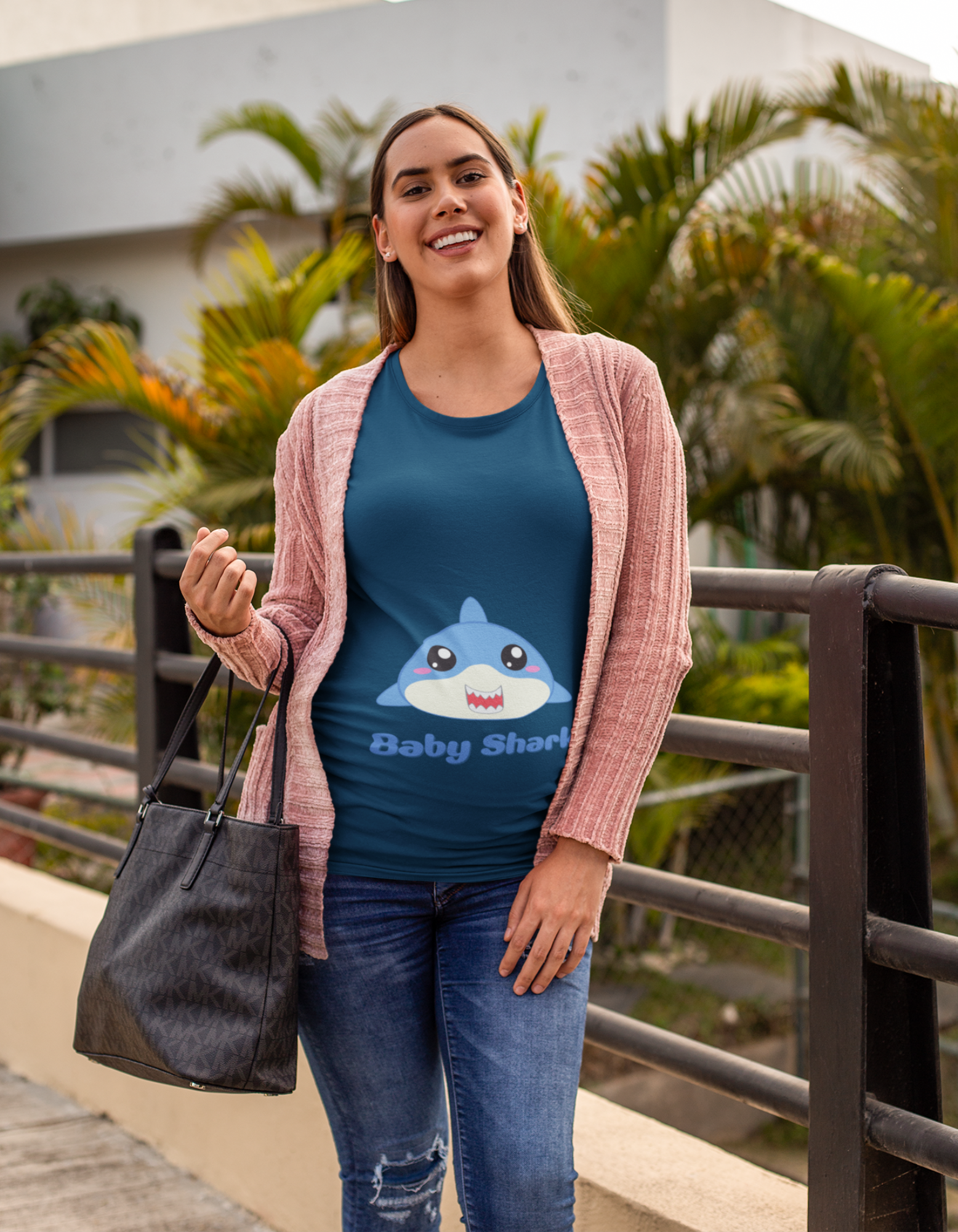 "Make a splash in your maternity wardrobe with Womanitee's Baby Shark Pregnancy T-Shirt. Experience the perfect blend of comfort and charm while expressing your love for your little one. Shop now!"