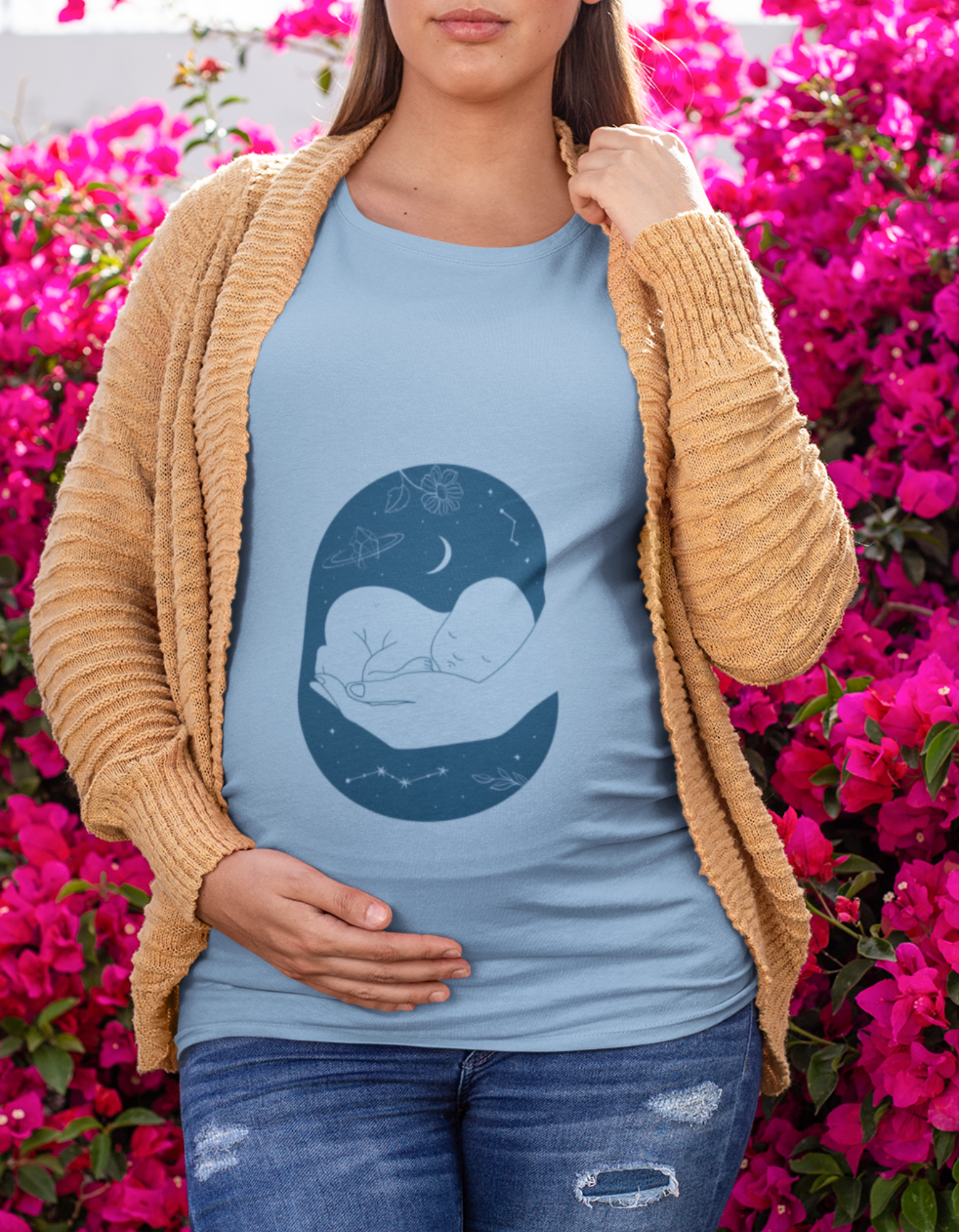 Wrap yourself in softness and style with Womanitee's Sleeping Baby Hand Pregnancy T-Shirt. Embrace the beauty of motherhood with a touch of whimsy. Shop women's t-shirts online now!