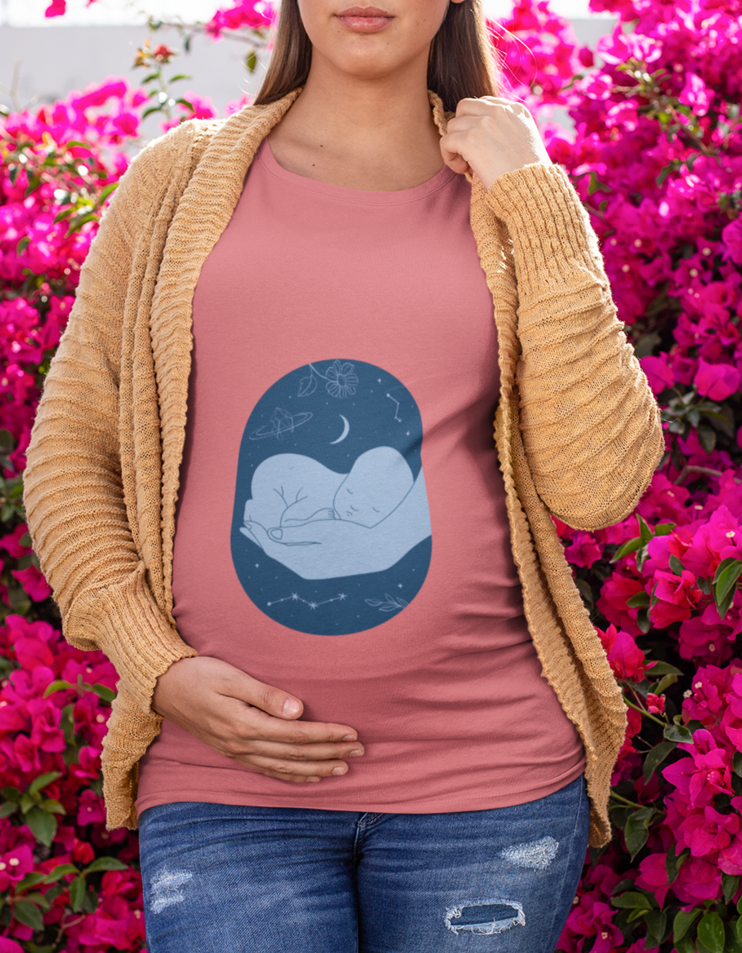 Discover the trendiest pregnancy t-shirt at Womanitee. Our Sleeping Baby Hand design combines fashion and comfort for modern moms-to-be. Browse our collection of women's graphic t-shirts online!