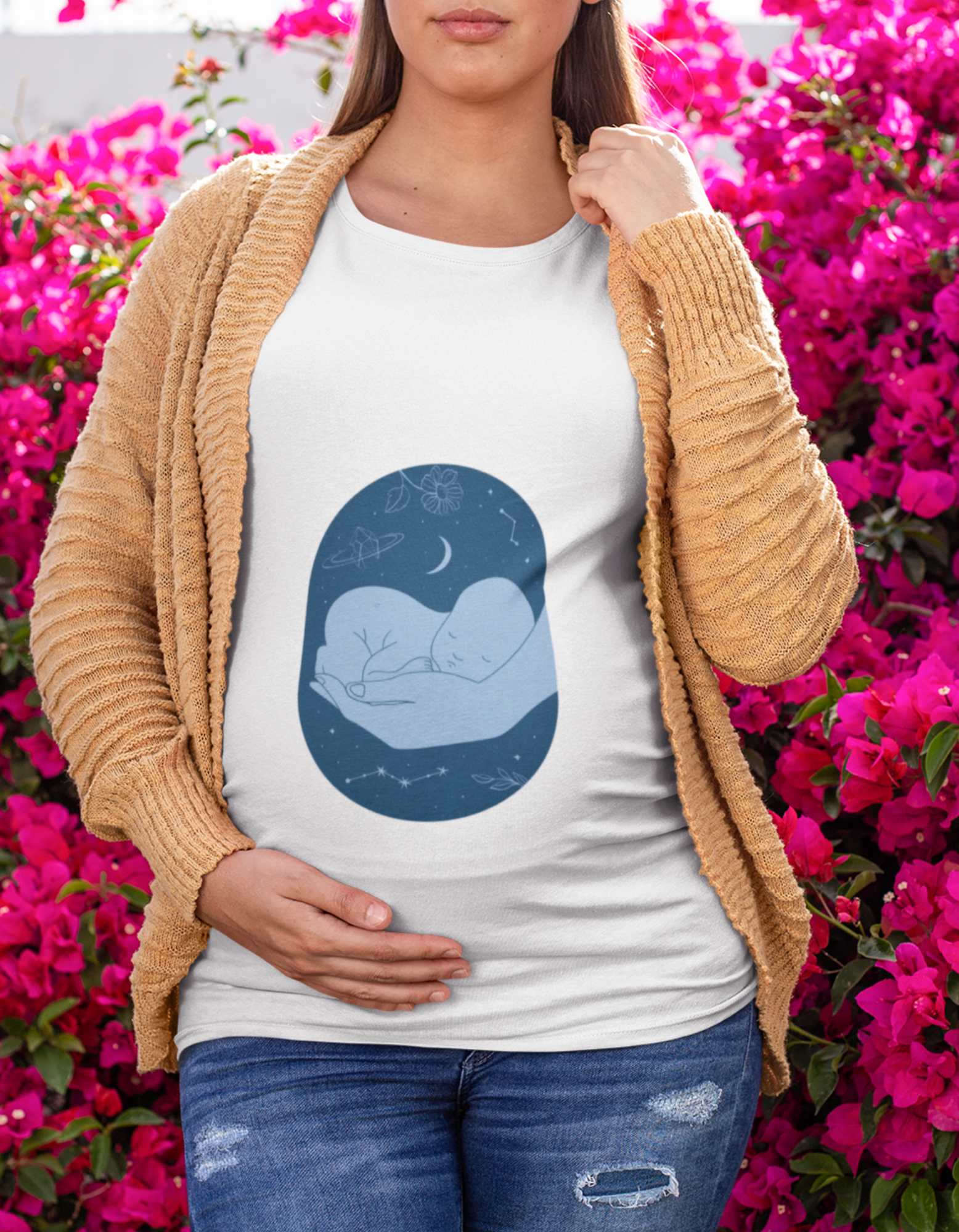 Get ready for dreamy nights with Womanitee's Sleeping Baby Hand Pregnancy T-Shirt. Unleash your stylish side with this enchanting t-shirt designed for modern moms. Shop now!