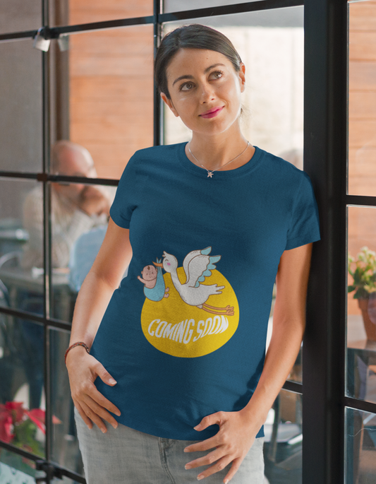 Express your playful side with Womanitee's Coming Soon Oversized Pregnancy T-Shirt. Adorable bird and baby illustration. Get yours today!