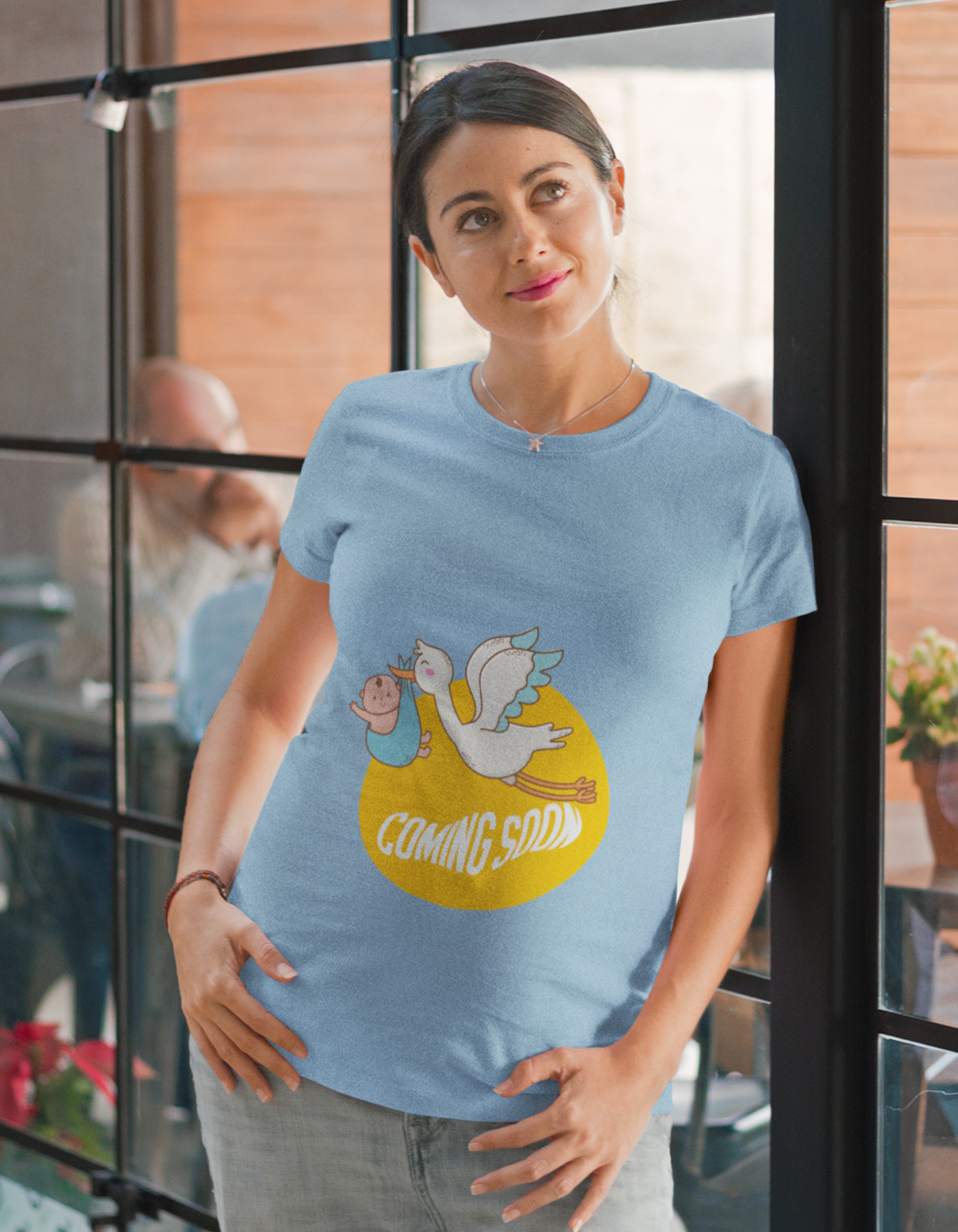 Unveil the joy of anticipation with Womanitee's Coming Soon Oversized Pregnancy T-Shirt. Symbolic bird and baby illustration. Shop today!