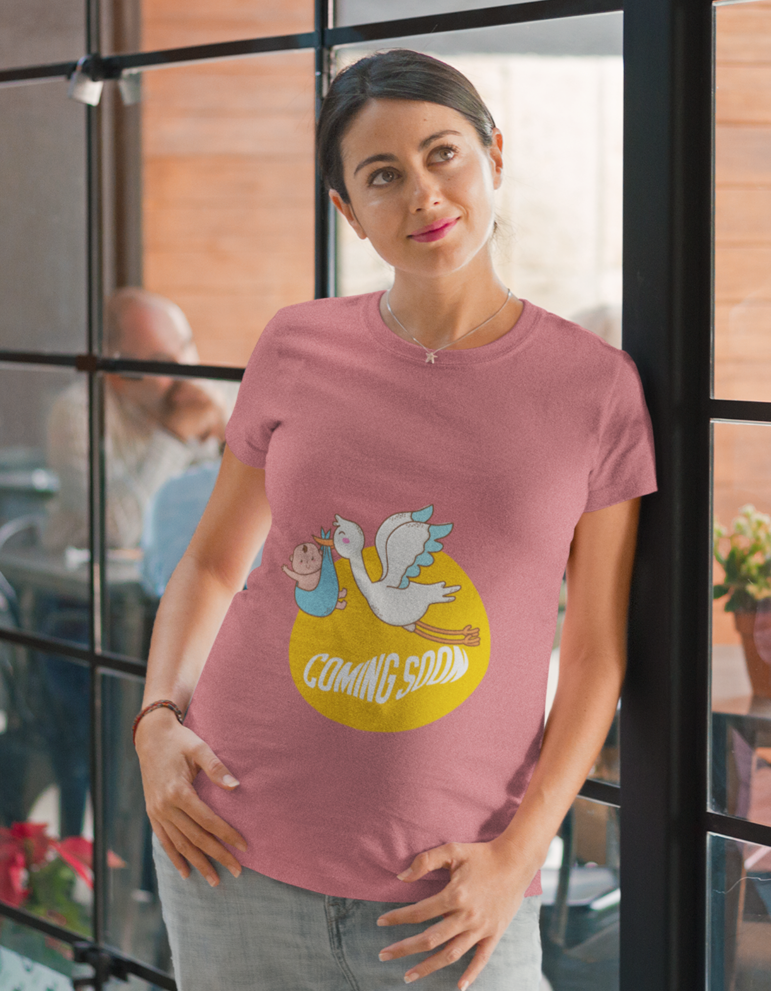 Unveil the joy of anticipation with Womanitee's Coming Soon Oversized Pregnancy T-Shirt. Symbolic bird and baby illustration. Shop today!