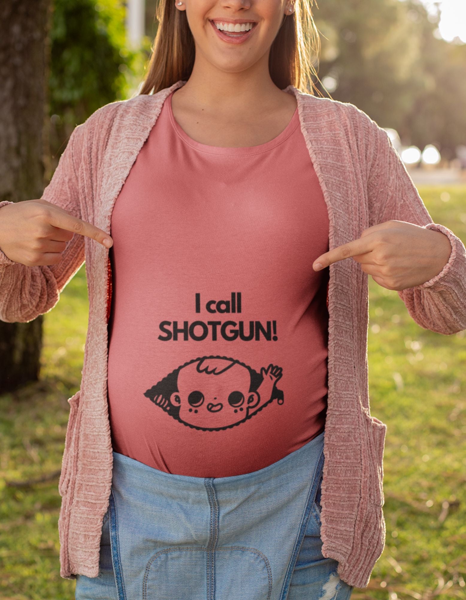 Prepare for the joys of motherhood with our oversized pregnancy t-shirt. The 'I Call Shotgun' design, featuring a baby peaking out of a zip, adds a touch of fun to your pregnancy style. Shop now and celebrate the beautiful journey at Womanitee!