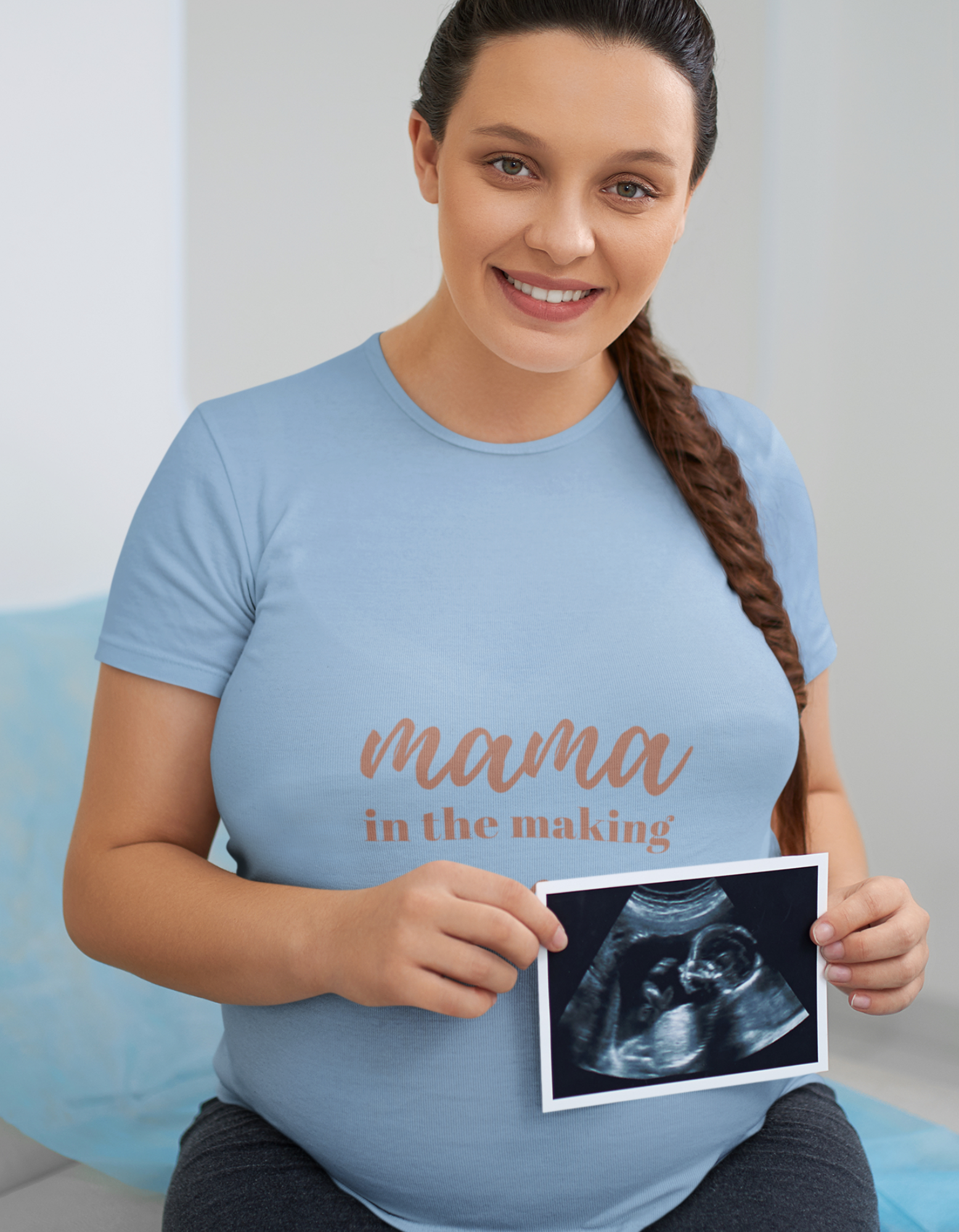 Unleash your inner mama power with our Mama in Making oversized pregnancy t-shirt. Made for modern moms, this t-shirt combines fashion and comfort effortlessly. Featuring 'Mama in Making' and a heart sign, it's a delightful way to announce your pregnancy. Shop now and enjoy the convenience of buying women's graphic t-shirts online at Womanitee.