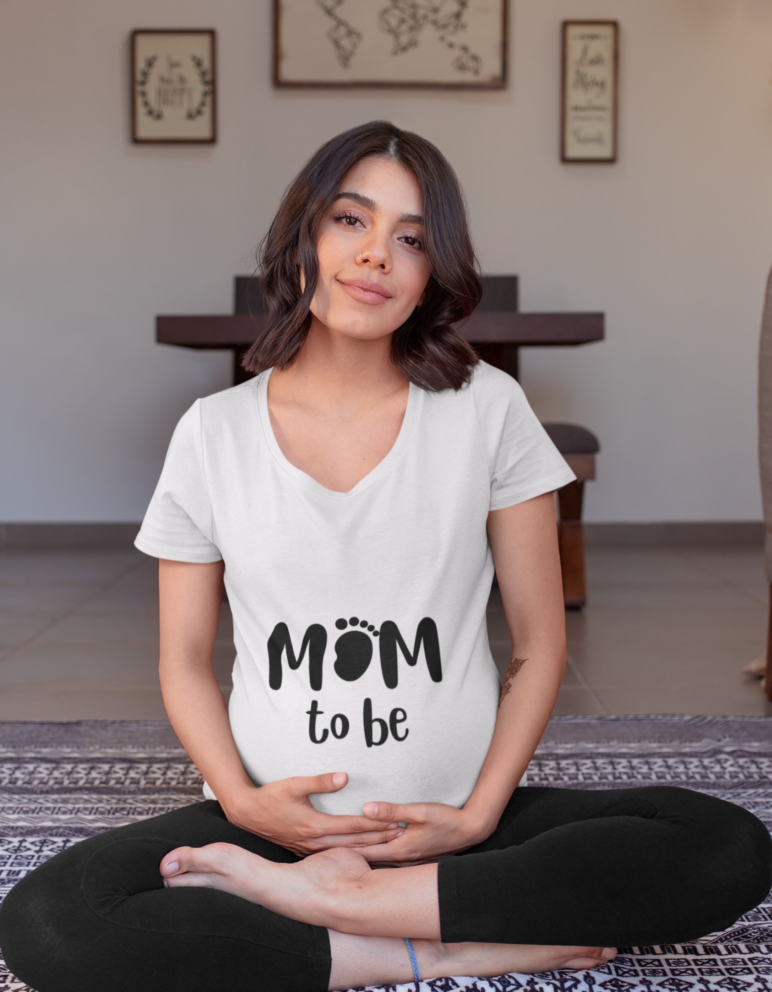 Flaunt your baby bump in style with our trendy pregnancy t-shirt. The unique design featuring a 'mom' with a baby footprint is both fashionable and adorable. Explore our collection of women's t-shirts online at Womanitee India.