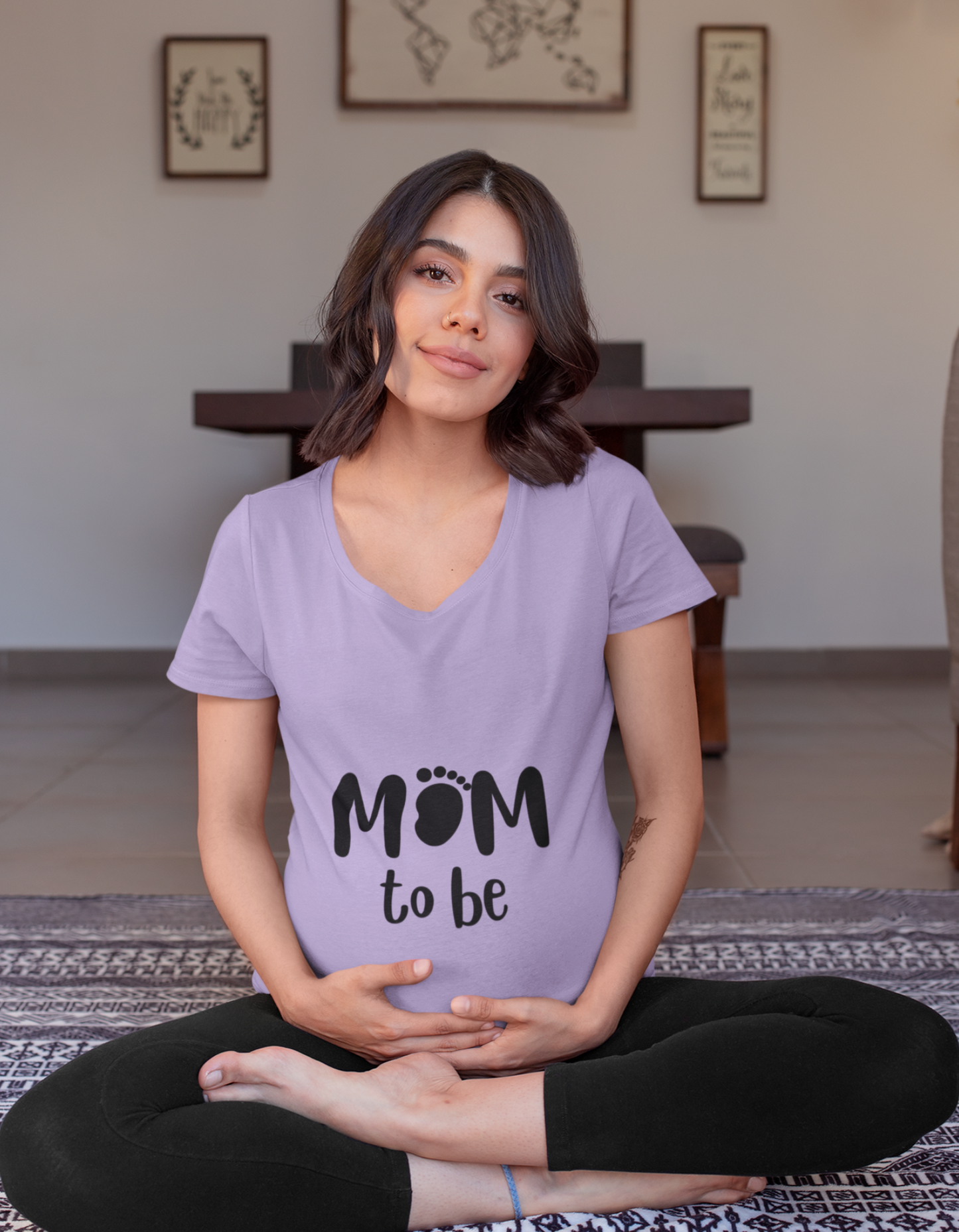 Embrace your pregnancy glow with our stylish Mom to Be oversized tee. The cleverly designed 'mom' with a baby footprint is a chic statement of your impending motherhood. Shop for trendy women's graphic t-shirts online at Womanitee.