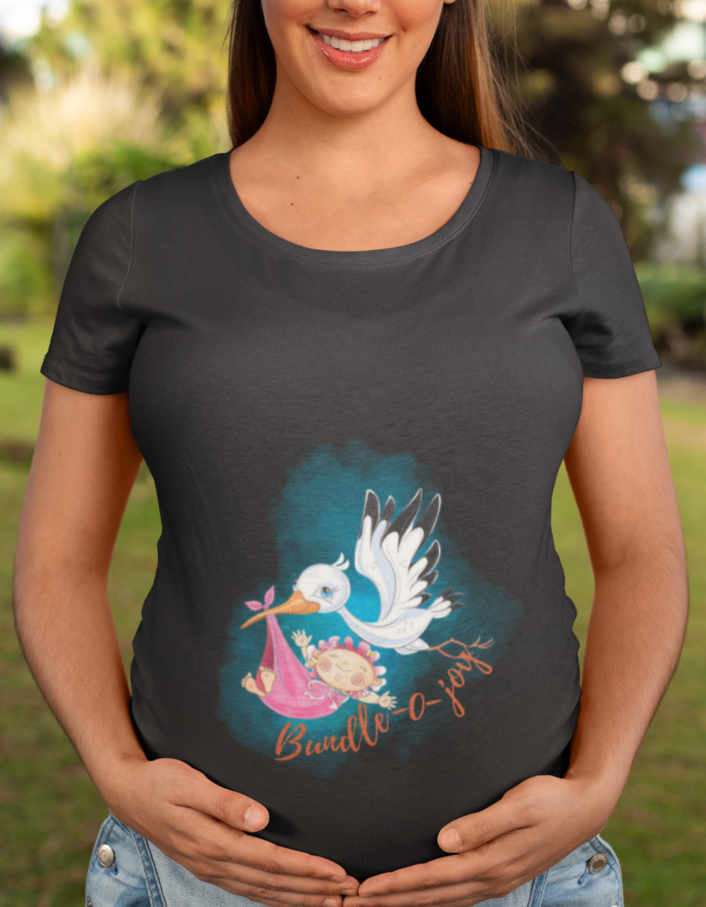 Express your excitement for motherhood with our Bundle of Joy pregnancy t-shirt. The clever 'Bundle-o-Joy' design featuring a bird and baby bundle is a fun way to showcase your happiness. Find your perfect fit at Womanitee, the destination for women's graphic t-shirts.