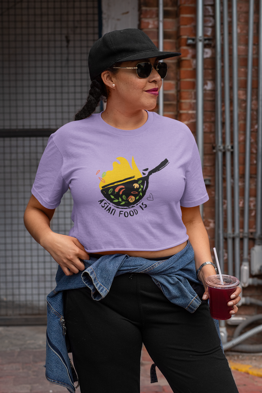 Combine style and taste with our Women's Crop Top. Adorned with a vibrant illustration of Asian food and the words 'Asian Food is Love,' this fashionable shirt celebrates your love for culinary delights. Discover the perfect blend of fashion and flavor at Womanitee