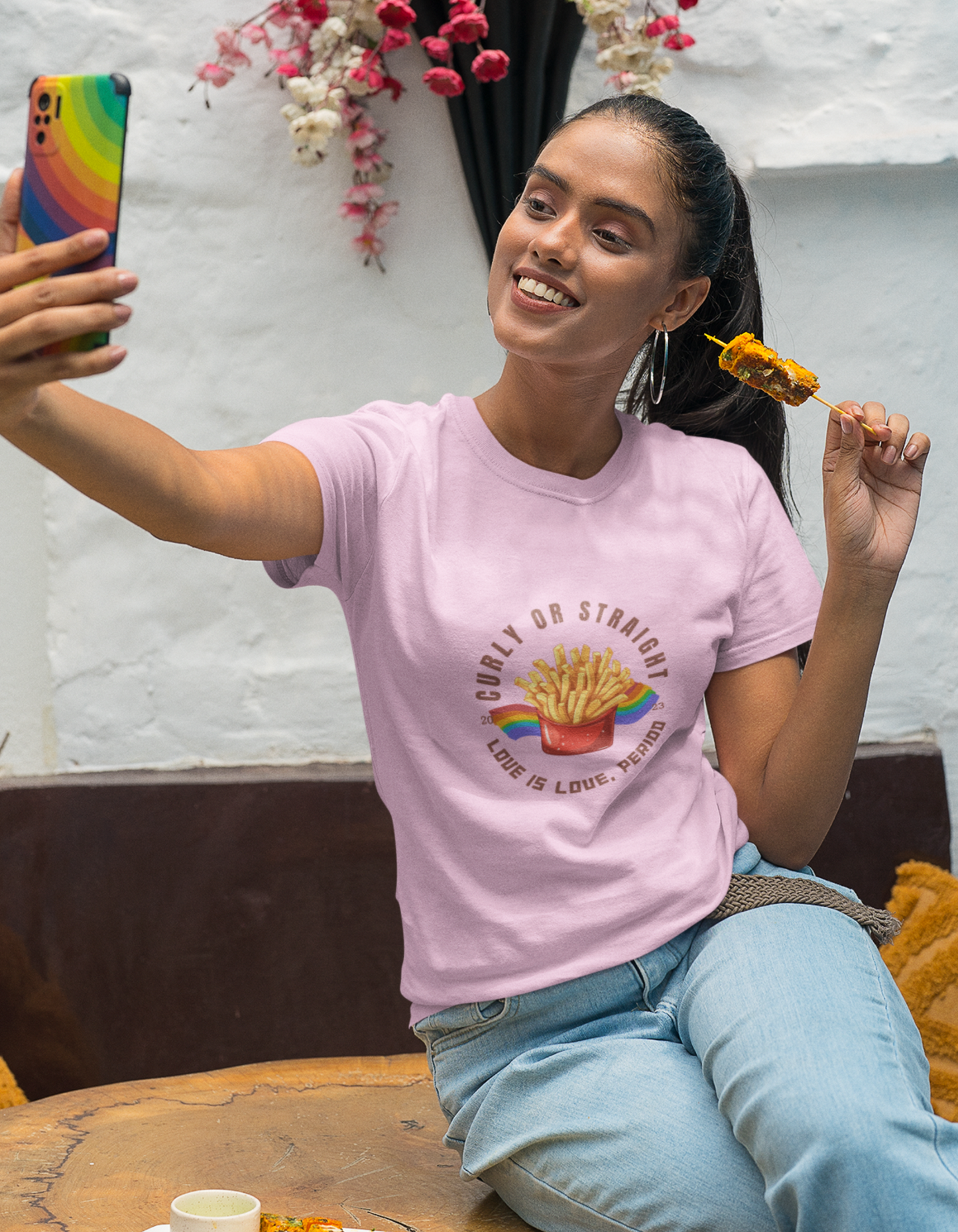 Embrace the message of love and acceptance with our light pink cotton t-shirt showcasing a delightful illustration of French fries and the inclusive text "Curly or Straight - Love is Love, Period." Order now from Womanitee and wear your support for love diversity.