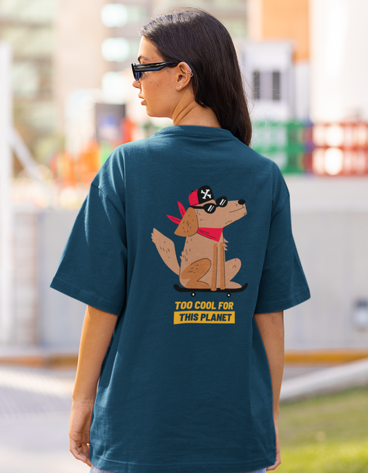 Embrace your inner coolness with our navy blue oversized t-shirt featuring an illustration of a stylish dog wearing a cap and sunglasses, along with the text "Too Cool for This Planet." Shop now at Womanitee, the best place to buy women's graphic tees online in India, and rock a look that's out of this world.