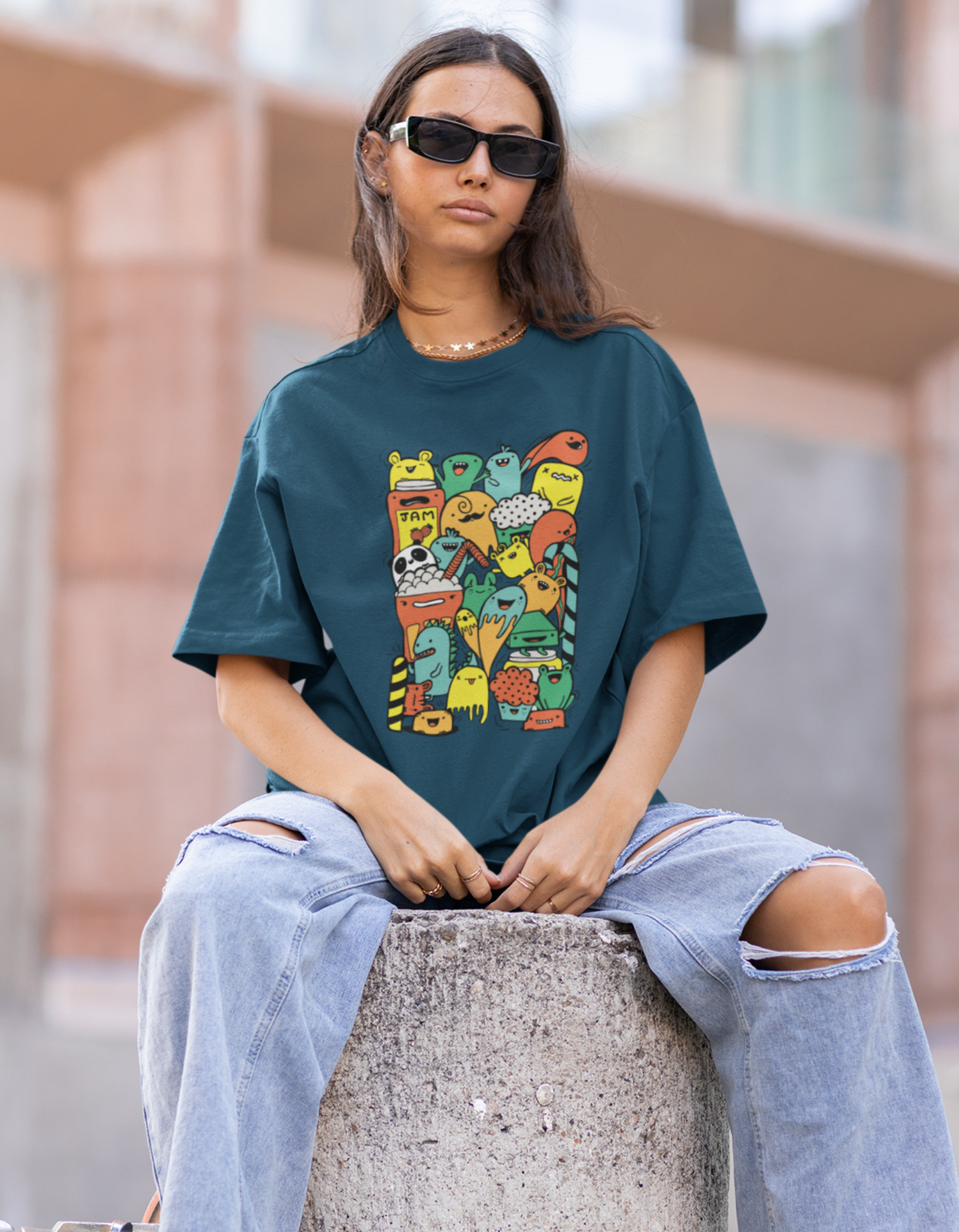 Stand out from the crowd with our navy blue oversized t-shirt showcasing artistic and colorful food doodles. Made with comfort in mind, this tee from Womanitee is perfect for food enthusiasts with a creative flair.