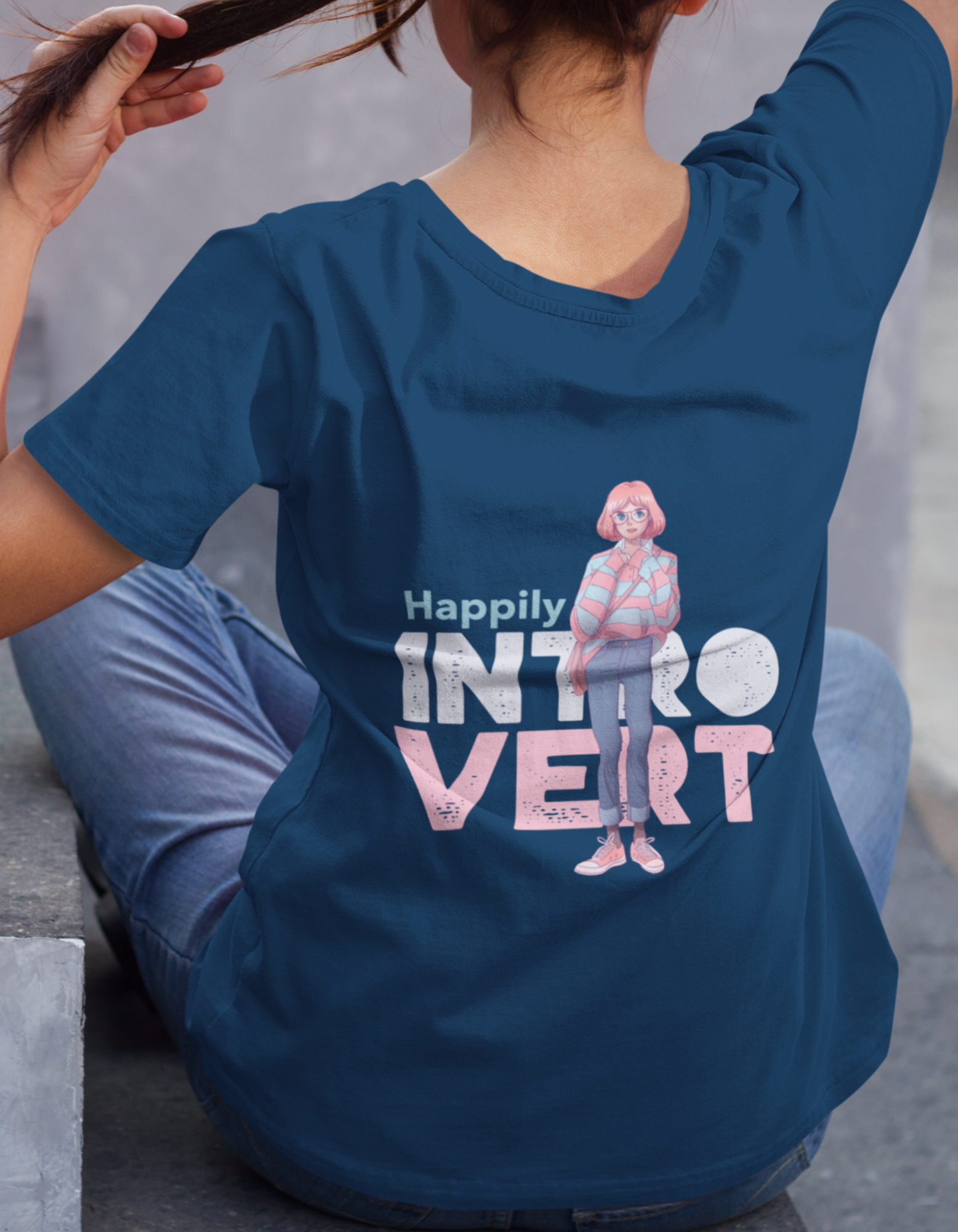 Embrace your introversion with our navy blue oversized t-shirt showcasing a back print that proudly states "Happily Introvert." Order now from Womanitee and express your inner tranquility through fashion.