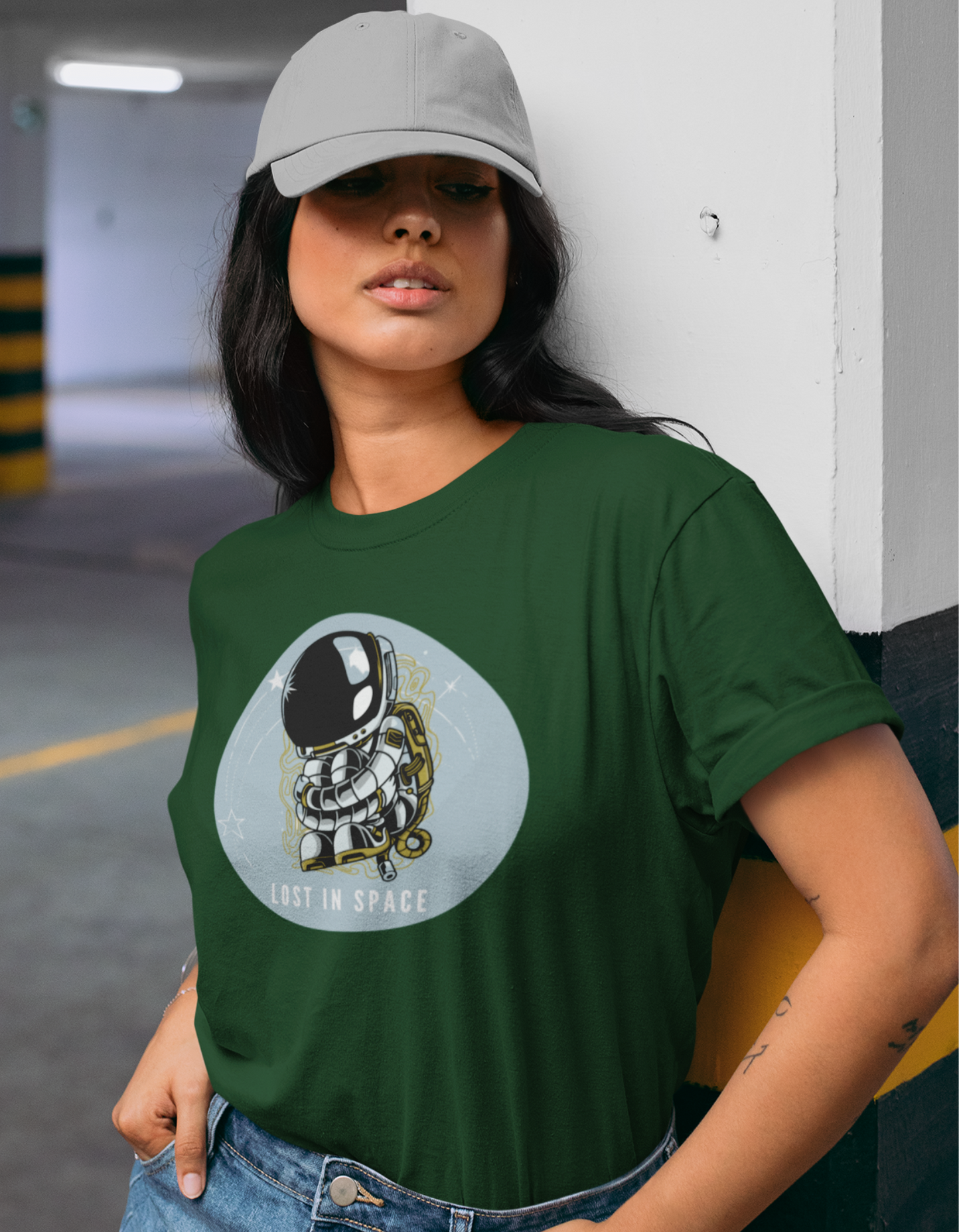 Shop our exclusive olive green cotton t-shirt with an astronaut illustration for women. Perfect for the modern woman who wants to stand out. Buy online now!