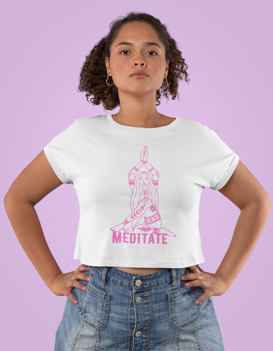 Elevate your fashion and elevate your spirit with the Womanitee Women's Meditate-Inspired Crop Top. This white crop top showcases a captivating meditating woman illustration, symbolizing inner alignment and self-care. Find your zen while looking fabulous. Shop online now!