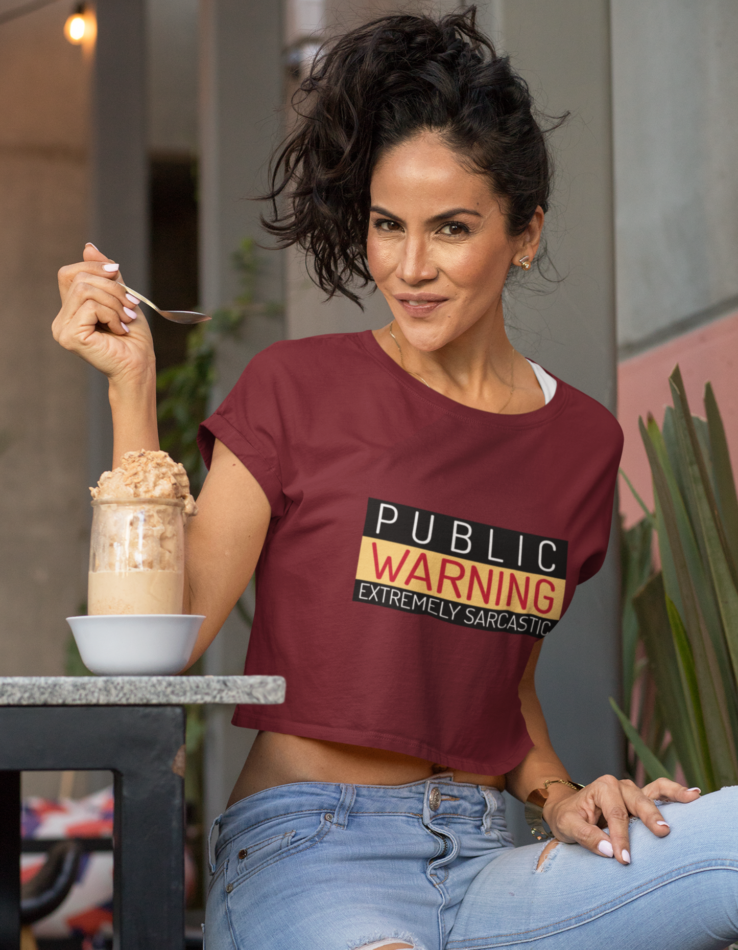 Make a bold statement with our Maroon Crop Top featuring the words 'Public Warning: Extremely Sarcastic'. Shop online at Womanitee for women's graphic t-shirts and crop tops. Express your witty side with style. Explore now!