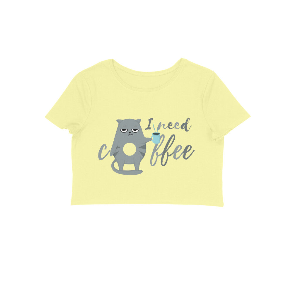 Fuel up your day with the Womanitee Women's Cat Lover Coffee Crop Top. Designed for cat moms who can't resist a good cup of joe, this butter yellow crop top features a charming cat holding a coffee mug and the catchy phrase 'I Need Coffee.' Embrace your cat mom status in style!