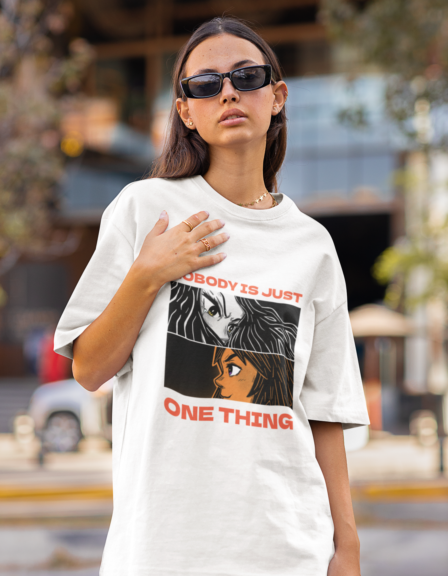 Express your complexity with our white oversized t-shirt showcasing two mesmerizing anime illustrations and the inspiring words "Nobody Is Just One Thing." Order now from Womanitee and celebrate your uniqueness!