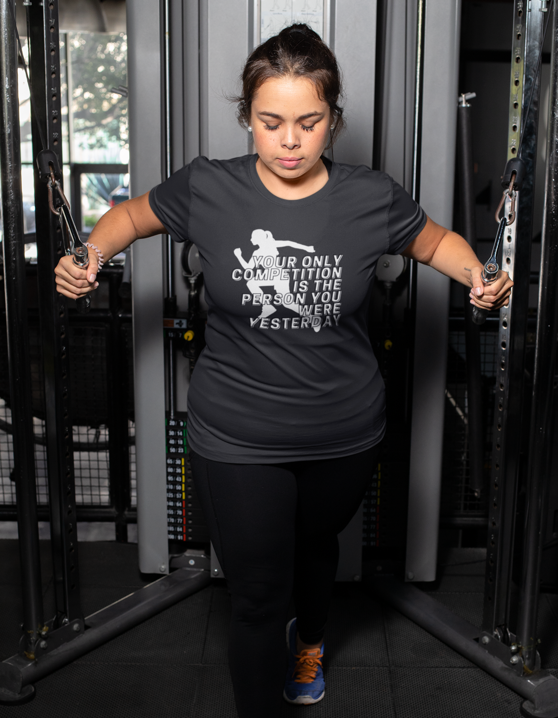 Elevate your fitness game with our black gym tee. Be your own competition and join the Womanitee community of strong, motivated women.