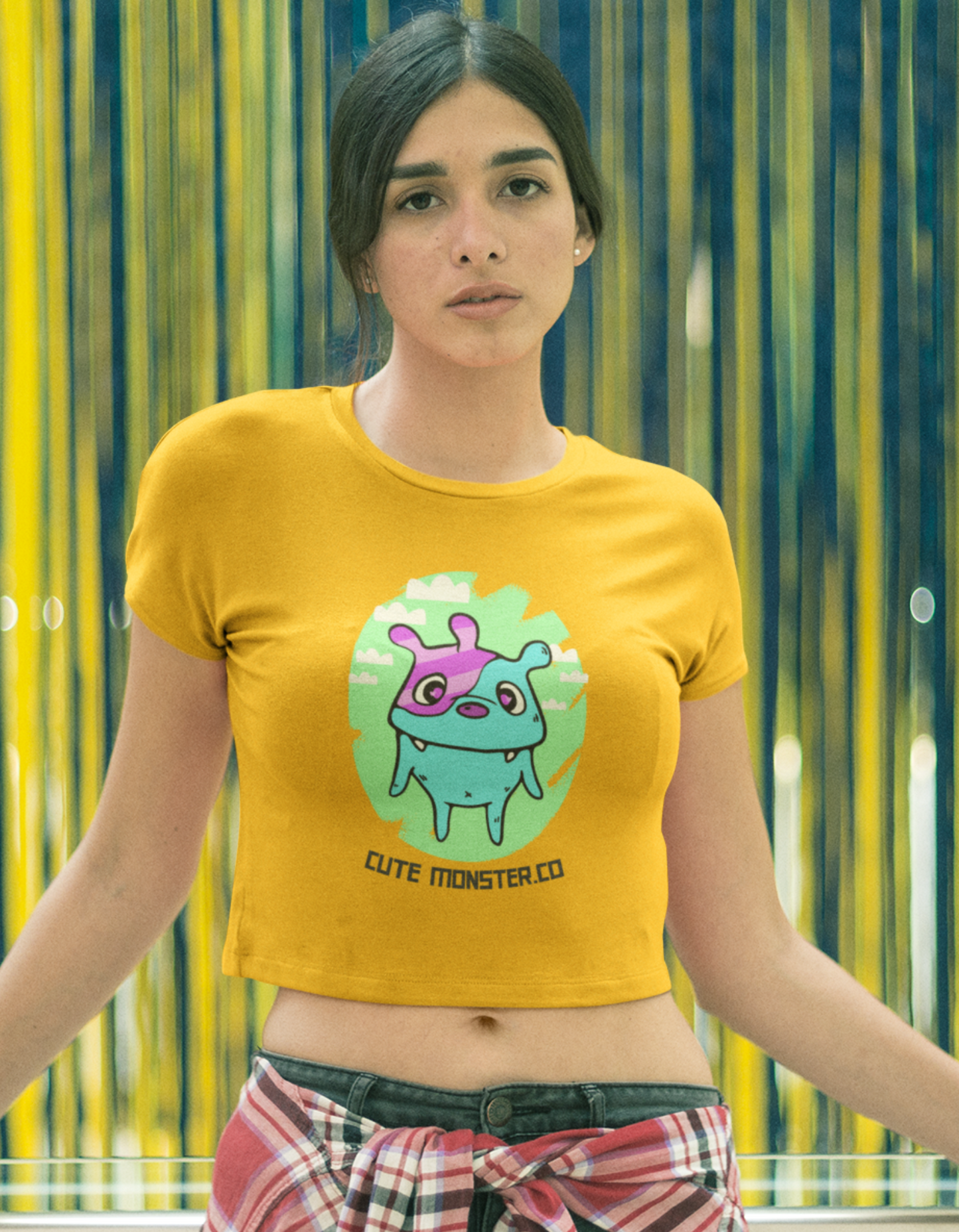 Express your unique style with our Women's Orange Monster Crop Top. Featuring a cute monster illustration and the playful message 'Cute Monster.Co', this crop top is perfect for the modern woman who loves to stand out. Shop online at Womanitee for trendy women's crop tops.