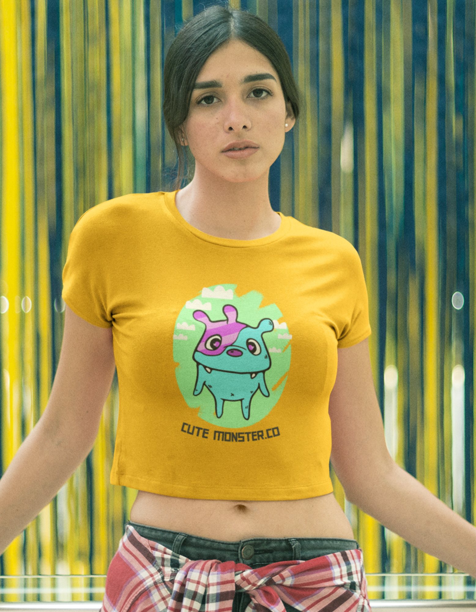 Express your unique style with our Women's Orange Monster Crop Top. Featuring a cute monster illustration and the playful message 'Cute Monster.Co', this crop top is perfect for the modern woman who loves to stand out. Shop online at Womanitee for trendy women's crop tops.