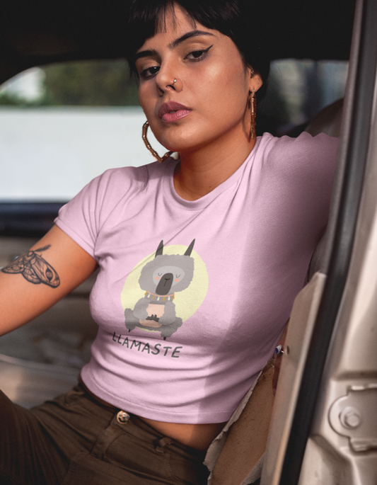 Looking for a crop top that's both stylish and comfortable? Our Womenitee light pink crop top with a funny Llama graphic and "Llamaste" message is perfect for yoga and beyond. Shop now and Namaste in style!